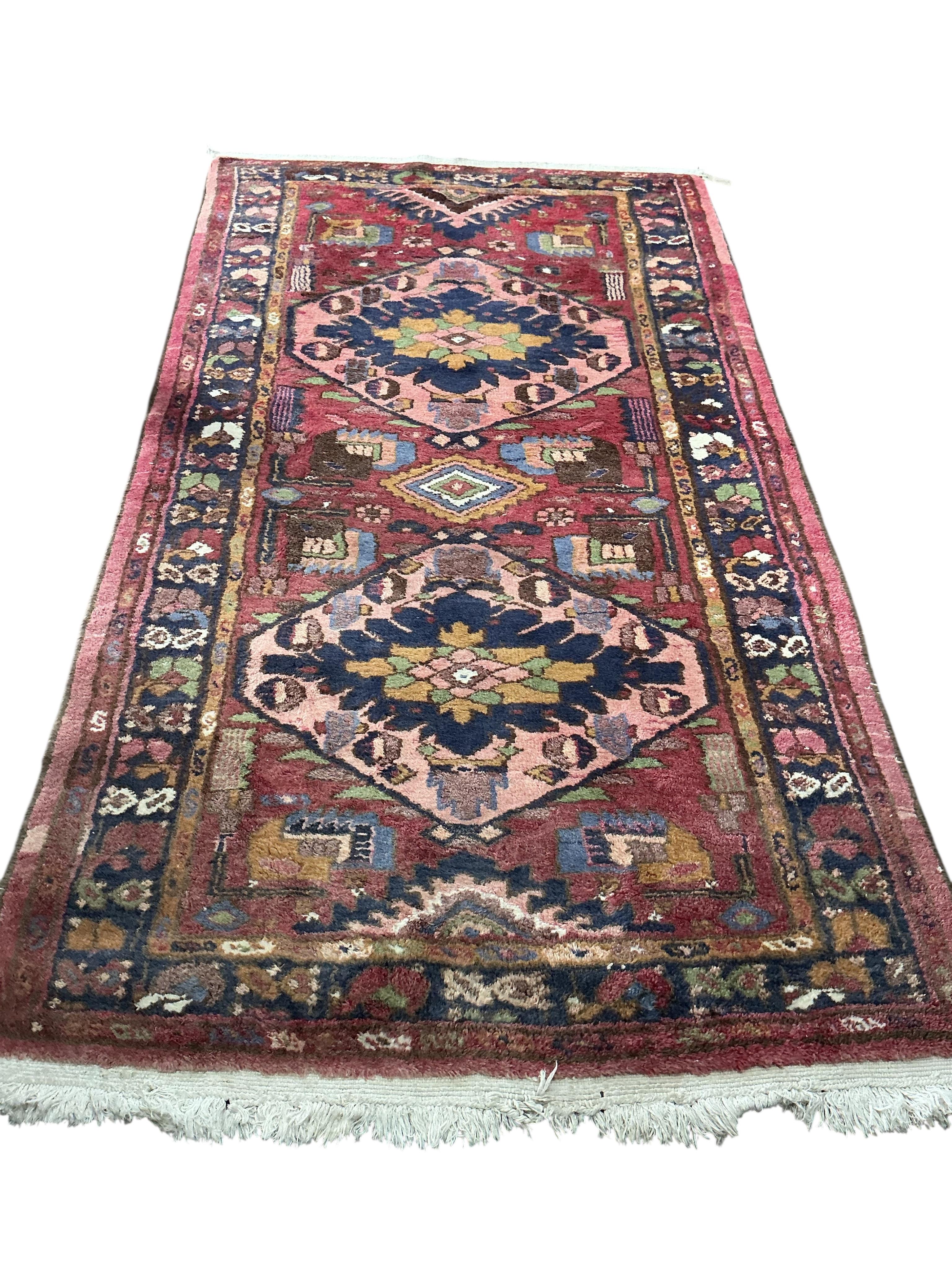 A Karabagh red ground rug, 200 x 112cm